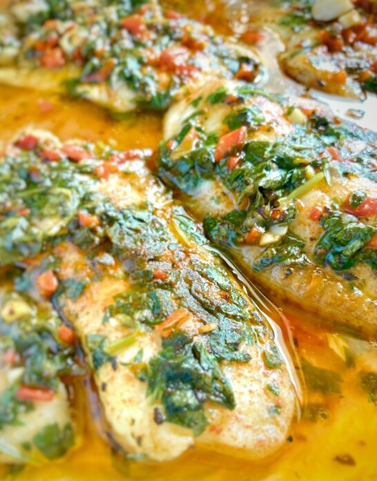 Chimichurri Tilapia - Musht fillets in Spanish-Israeli homemade sauce in oven pan.