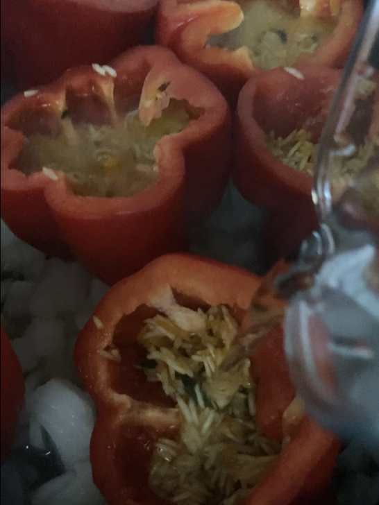 red bell peppers with uncooked rice stuffing