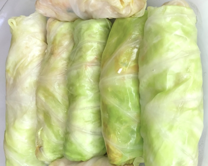 Set aside cabbage rolls and prepare pan sauce and vegetables padding, on which to cook the rolls.