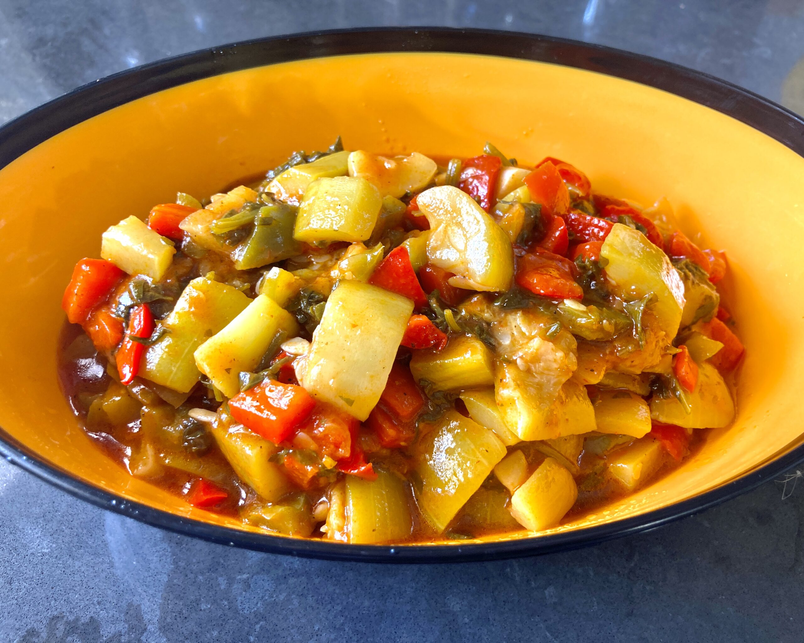 zucchini, red and green bell peppers in tomato sauce