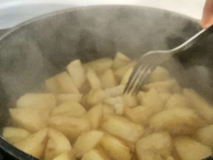 sliced potatoes to cook in water for rustic mashed potatoes