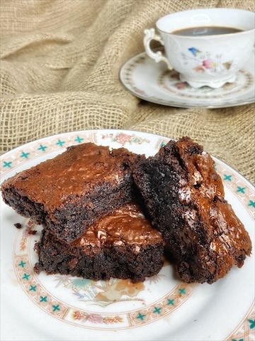 Rich brownies sliced after chilling in fridge.