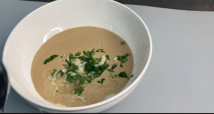 Raw tahini with parsley, lemon juice, chopped parsley and minced garlic