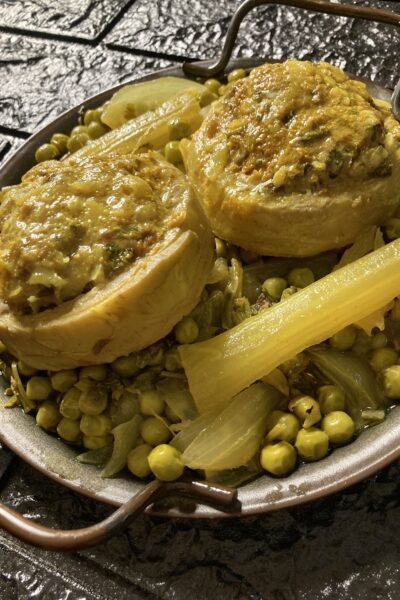 Stuffed artichoke bottoms cooked with peas